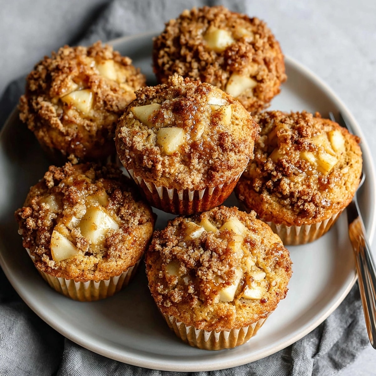 Maple Apple Breakfast Muffins served warm in a cozy kitchen as a fall breakfast treat.