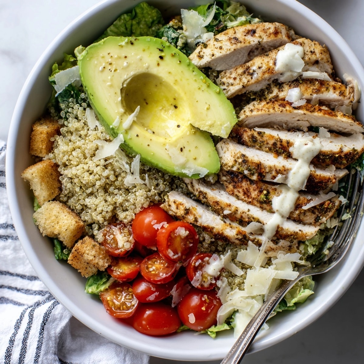 Deconstructed Avocado Chicken Caesar Grain Bowl before tossing; a colorful, healthy, protein-packed meal.