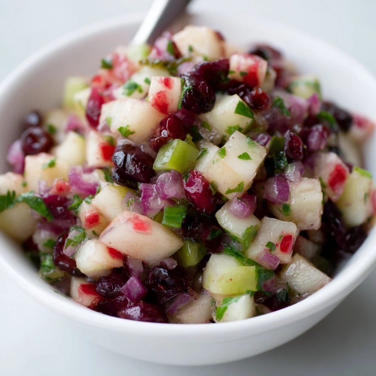 Zesty Pear and Cranberry Jalapeño Salsa with crunchy textures, perfect for summer gatherings.
