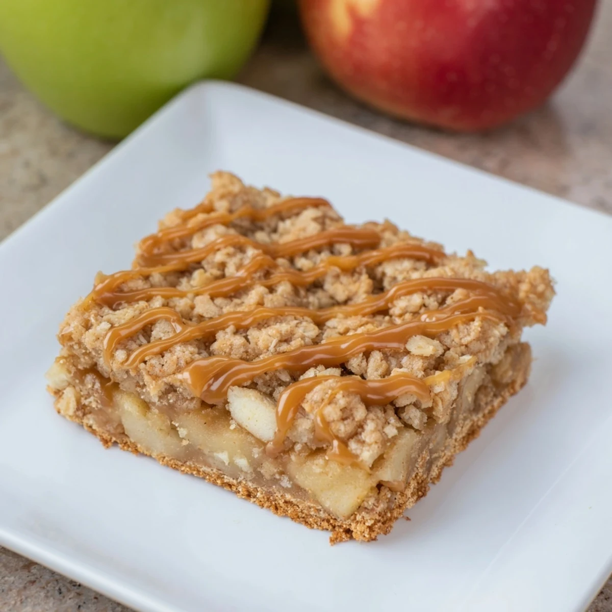 Warm, golden Caramel Apple Cookie Bars with a gooey caramel layer, promising a sweet, comforting bite.