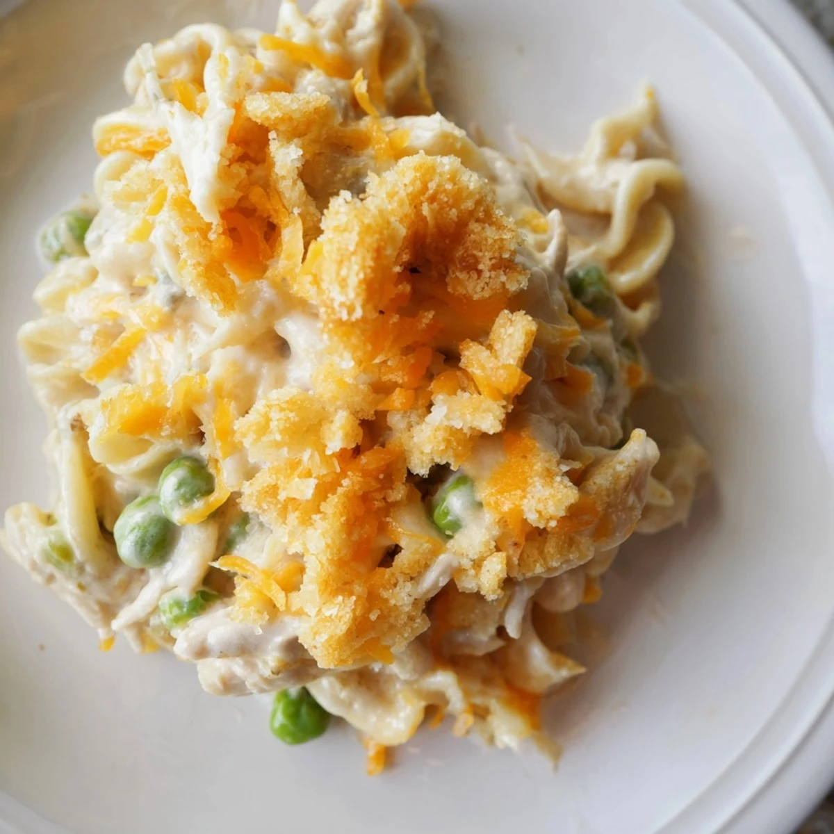 Delicious, homemade Creamy Tuna Noodle Casserole with a golden topping, ready for serving.