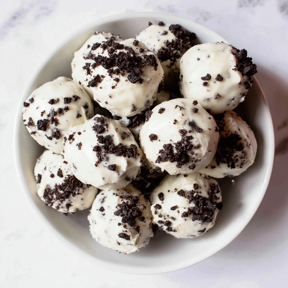 Imagine: a close-up shot of several perfectly formed Cream Cheese Oreo Protein Balls, ready to enjoy.