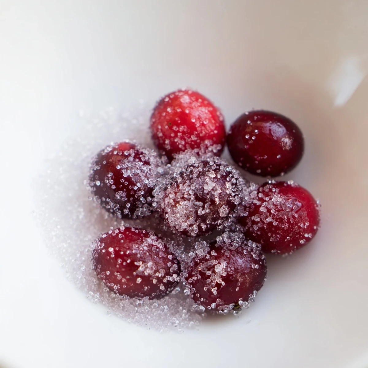 Vibrant red 5-Minute Express Candied Cranberries ready to eat, perfect for topping festive dishes.