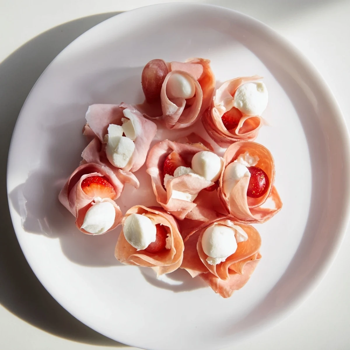 Elegant Prosciutto Rose Bouquet Board: a beautiful charcuterie appetizer brimming with savory meats and cheeses.