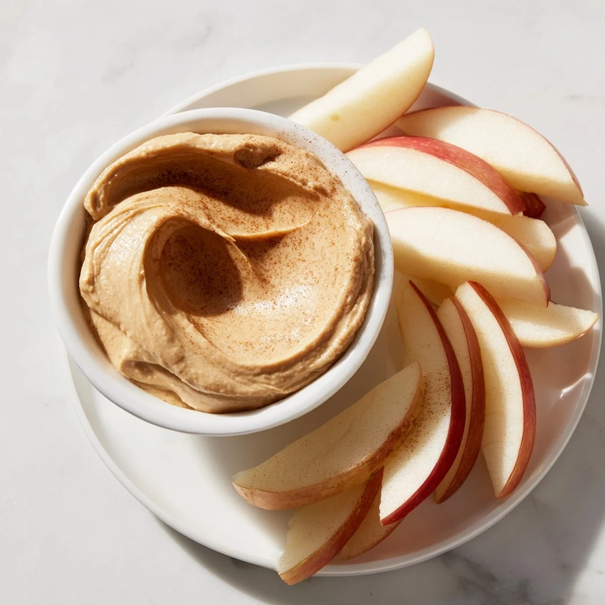 Enjoy the simple pleasure of fresh apple slices served with a smooth peanut butter dip.