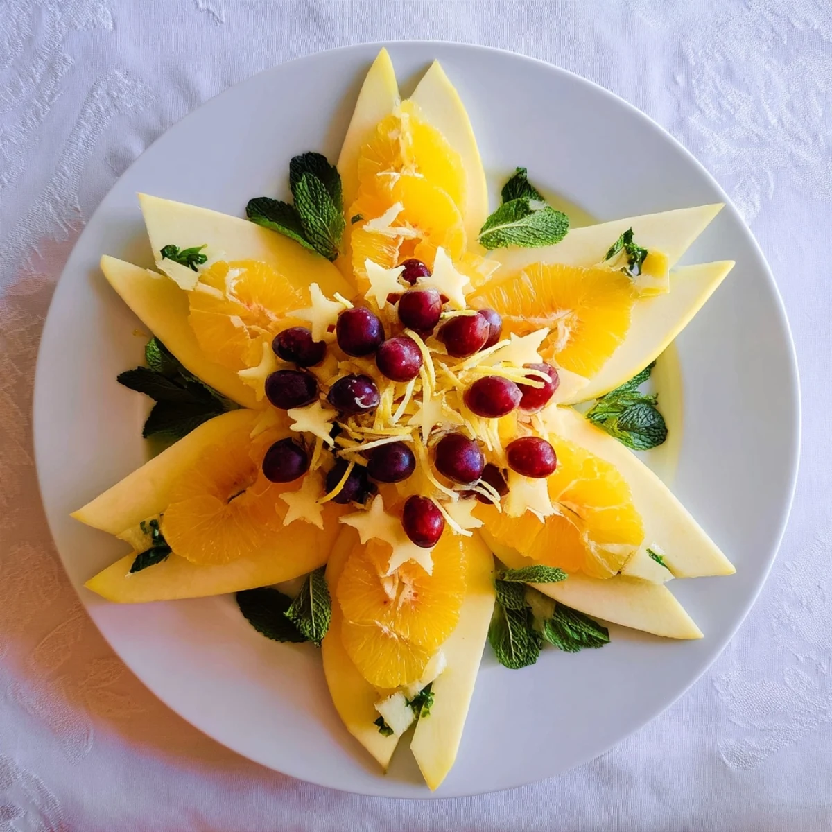 Plate of brunch fruit: Sliced starfruit and grapes, a colorful, refreshing garnish option.
