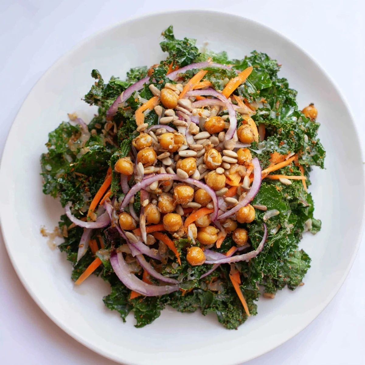 Close-up of a colorful Kale Salad with Roasted Chickpeas, featuring crunchy chickpeas and massaged kale.
