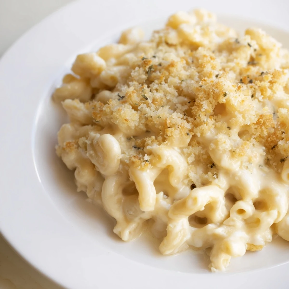 Golden, bubbly baked mac and cheese, perfectly browned with a crispy panko topping.