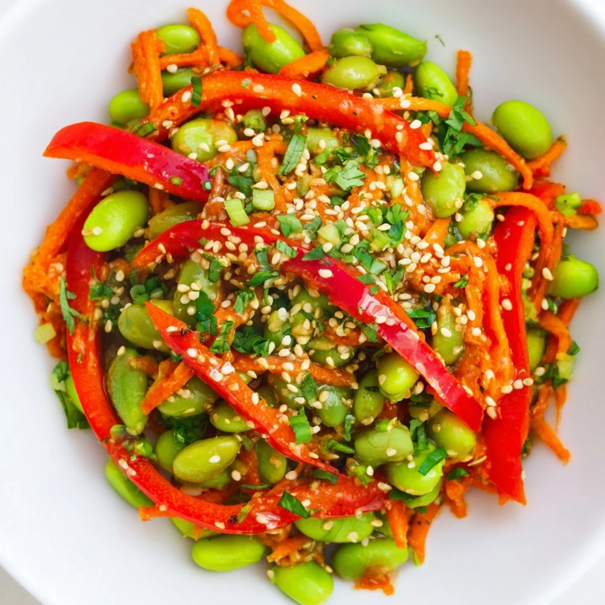 Fresh Asian Edamame Salad, bursting with vibrant veggies and a zesty sesame ginger dressing.