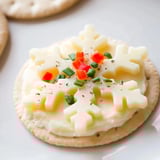 Festive Savory Bites Cracker and Cheese Snowflake Design, arranged creatively on a serving platter.