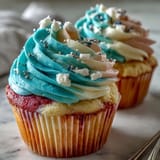 Fluffy Gemini Birthday Cupcakes topped with a striking yellow and lavender dual-tone frosting swirl.