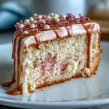 Elegant pink Rosé Velvet Cake with delicate cream cheese frosting and gold accents.