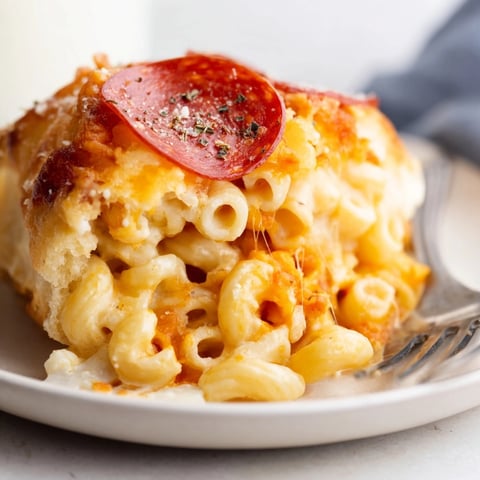 Cheesy Pepperoni Mac Bombs: Golden baked dough hugs cheesy, savory pepperoni mac inside.