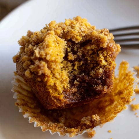 Buttery Pumpkin Cornflake Muffins topped with crunchy flakes, perfect for cozy mornings.  