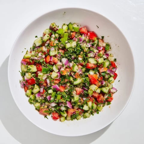 Vibrant Pickle De Gallo salsa with fresh cilantro and lime, ready to scoop with crispy tortilla chips.