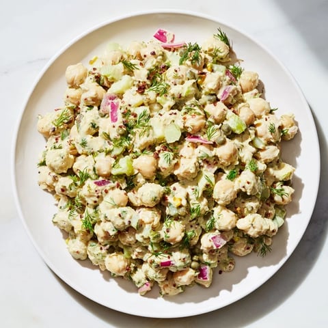 Vibrant chickpea tuna salad, creamy and delicious, ready to be scooped onto a sandwich or wrap.