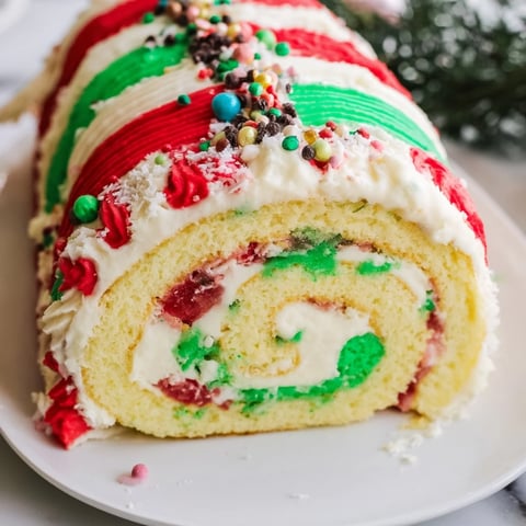 Festive Ugly Sweater Cake Roll with colorful frosting and playful holiday sprinkles, ready to serve.