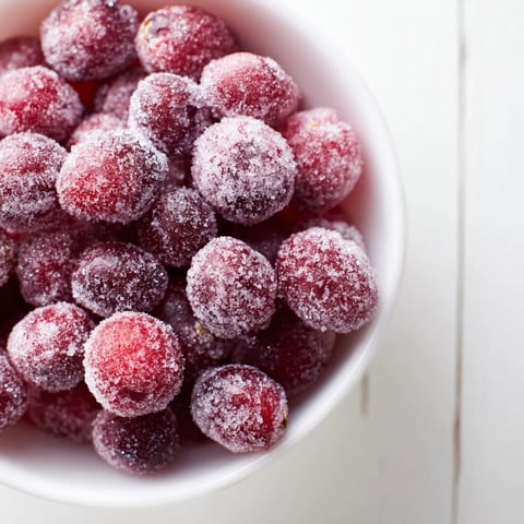 Sparkling 5-Minute Express Candied Cranberries, a festive treat with glistening sugar coating, ready to enjoy.