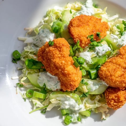 Fresh, vibrant Green Goddess Nugget Salad with crispy chicken and creamy dressing, a delightful lunch.