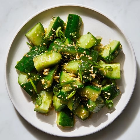 Crisp Cucumber Shaker with rice vinegar, a refreshing bite of Asian-inspired flavors, perfect for summer.