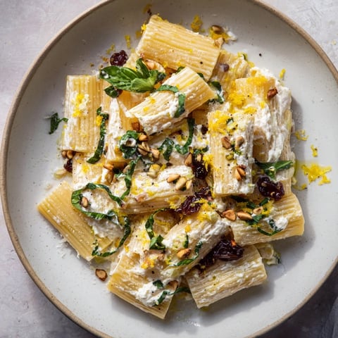 Pasta with Roasted Grapes and ricotta, a colorful plate featuring blistered grapes and creamy sauce.