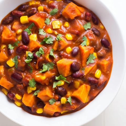 A warm bowl of Smoky Sweet Potato Chili, filled with sweet potatoes and hearty beans.
