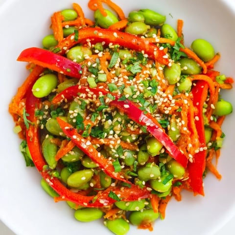 Fresh Asian Edamame Salad, bursting with vibrant veggies and a zesty sesame ginger dressing.