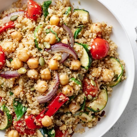 Vibrant Quinoa Power Protein Salad, loaded with roasted vegetables and drizzled with a creamy dressing.