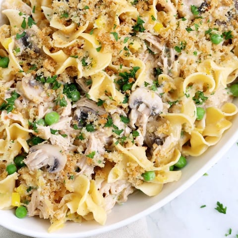 Creamy Tuna Noodle Casserole 2.0 with golden topping, ready to serve, a comforting classic.