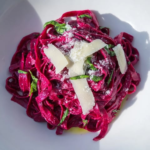 Roasted Beet Noodle Pasta with vibrant magenta color, ready to be tossed with herbs and cheese.
