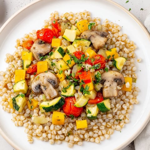 Creamy Pearled Barley Bowl brimming with oven-roasted vegetables; a comforting vegetarian dinner.