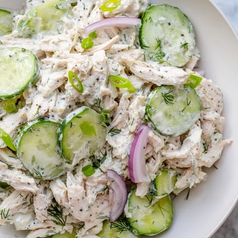 Creamy Cucumber Chicken Salad, a vibrant mix of chicken, cucumber, and dill-infused yogurt, ready to eat.