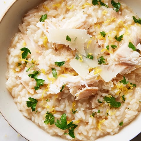 Creamy Smoked Haddock Risotto with tender flaked fish, Parmesan, and fresh parsley on a rustic plate.  