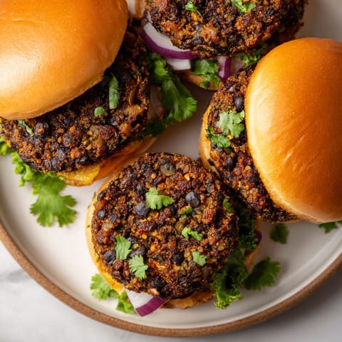 A plate of sandwiches with meat and vegetables.