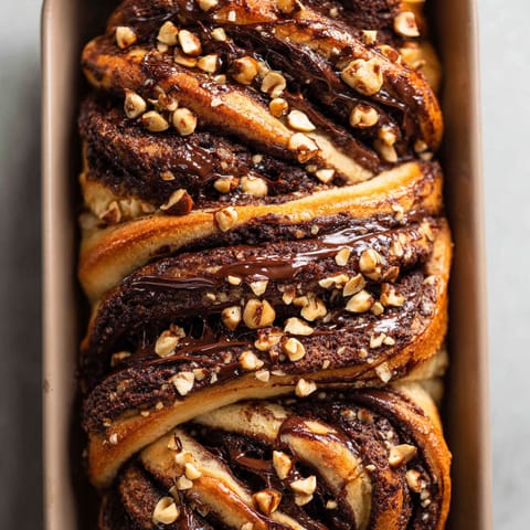 A cake with chocolate and nuts.