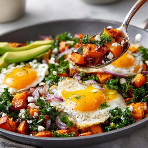 A pan of food with a spoon in it.