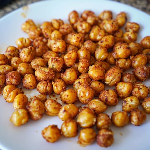 Homemade Garlic BBQ Roasted Chickpeas: a simple, savory vegan snack on rustic parchment.