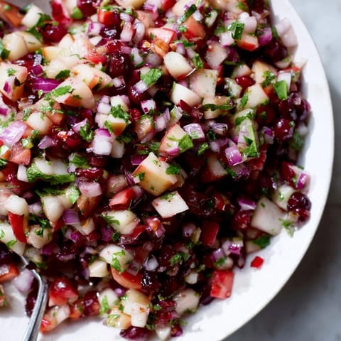 Vibrant Pear and Cranberry Jalapeño Salsa elegantly garnished, ideal as a flavorful topping.  