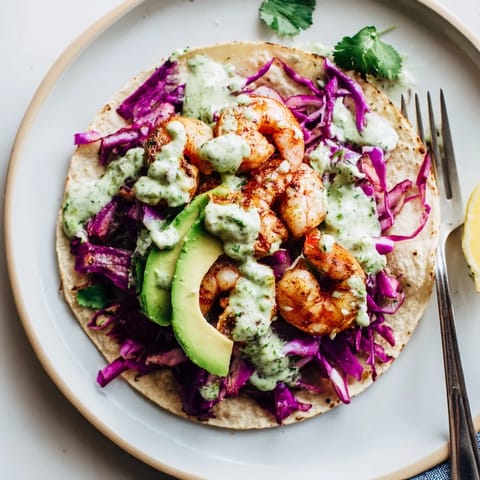 Sizzling Lemon Herb Shrimp Tacos nestled in warm tortillas with zesty toppings.  