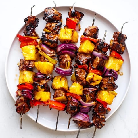 Delicious Grilled Pineapple & Jerk Chicken Skewers, perfect for summer barbecues.  