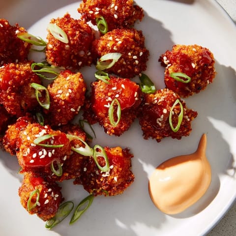 These tender Bang Bang Chicken Bites are perfectly crispy, offering a delicious appetizer for sharing.