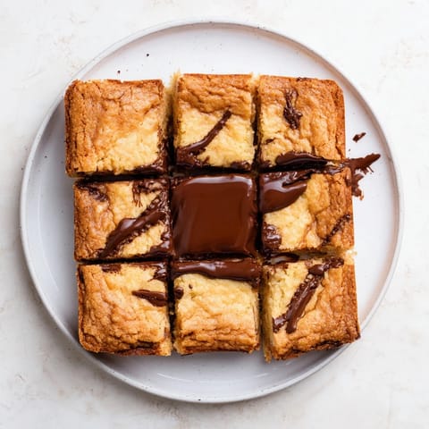 A close-up of decadent air fryer gooey cookie cups, showcasing a melty chocolate center.