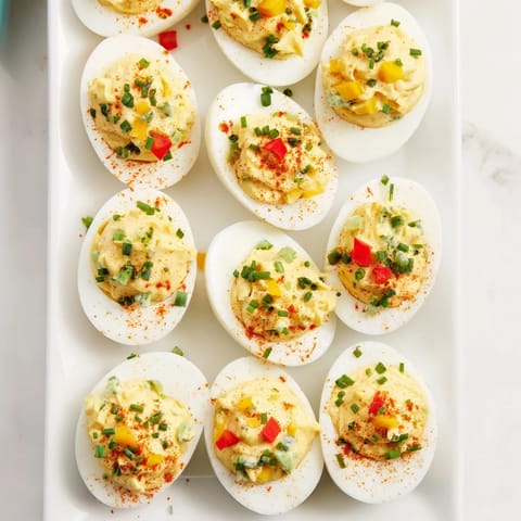 A delicious Christmas Tree Deviled Eggs appetizer, artfully arranged and garnished for holiday celebrations.