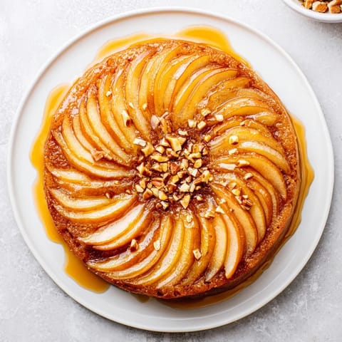 Sweet honey glazes the perfectly arranged pear slices, ready for a delightful, quick snack.
