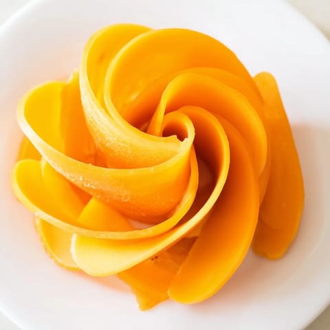 Golden sharp cheddar and sweet apricot slices create a delicious Copper Coil cheese board arrangement.