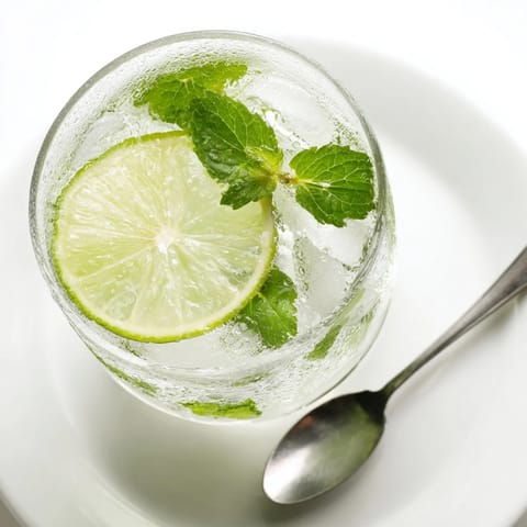 Bright green Mint Lime Agua Fresca is an icy, non-alcoholic Mexican refreshment for summer.