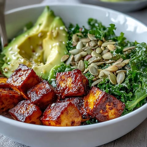 Vibrant Tofu Breakfast Bowl with creamy avocado and bright green kale.