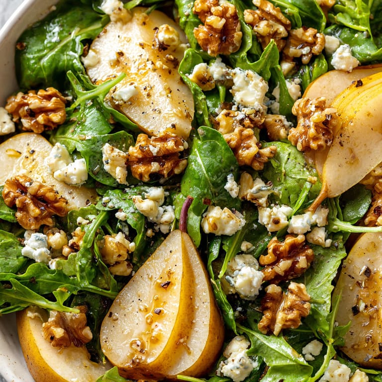A salad with apples, spinach, and walnuts.
