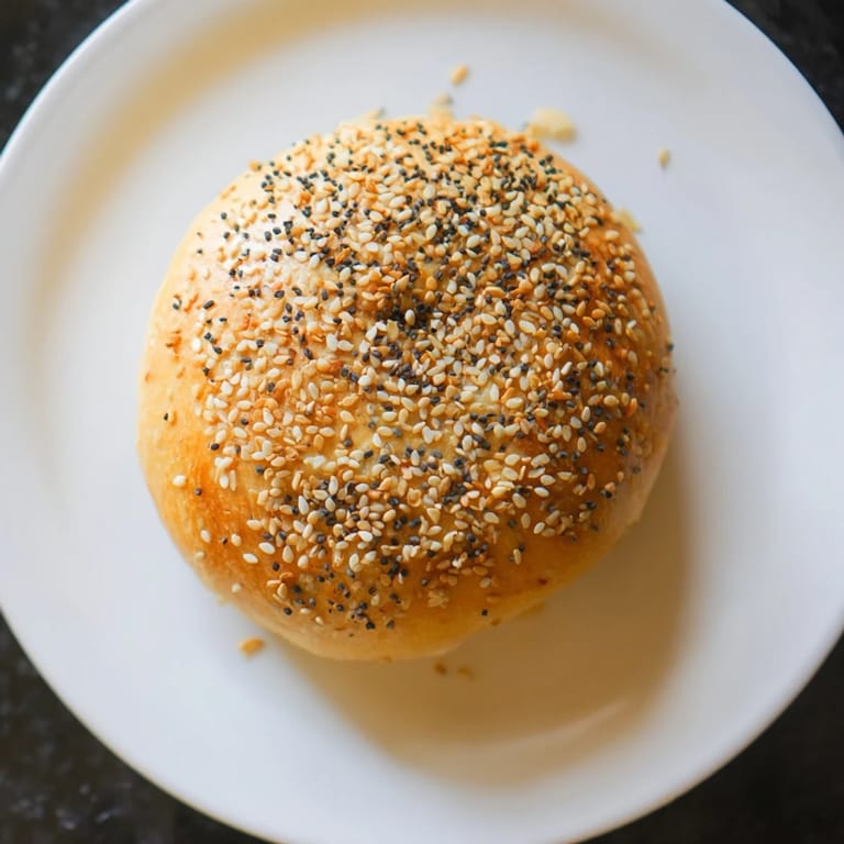 A close-up of delicious Homemade Budget Bagels, perfect for slathering with cream cheese or your favorite toppings.