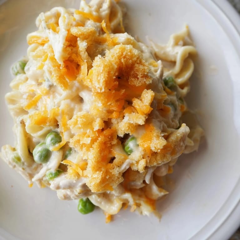 Delicious, homemade Creamy Tuna Noodle Casserole with a golden topping, ready for serving.